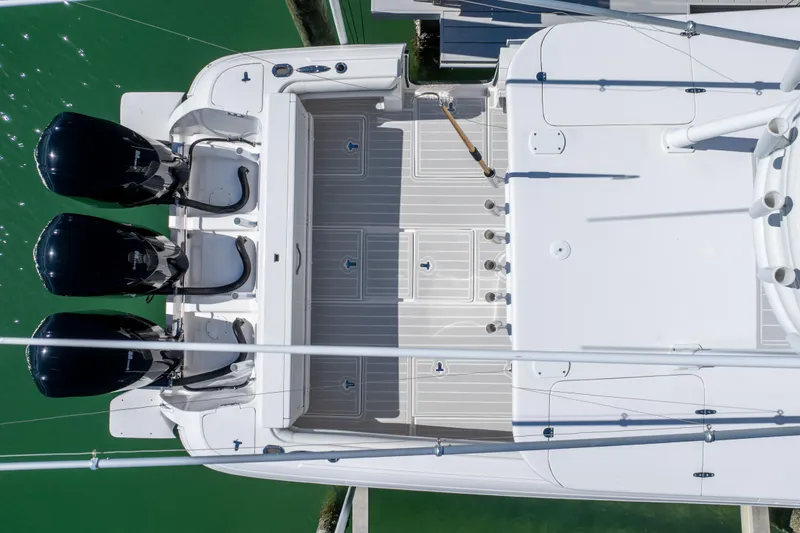 Slide: The Image of Top view of a 2015 Intrepid 400 Center Console boat with triple engines. - 8