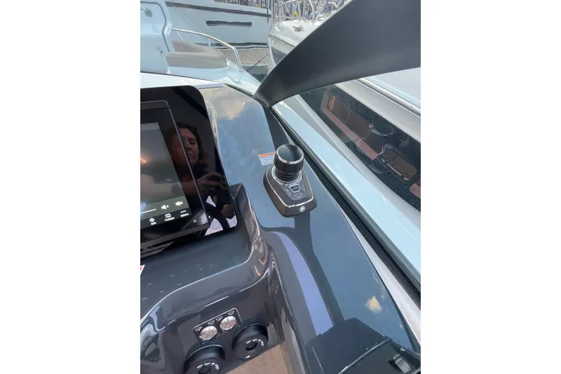 Slide: The Image of Control panel of 2026 Jeanneau TH33 boat with touchscreen and joystick. - 10