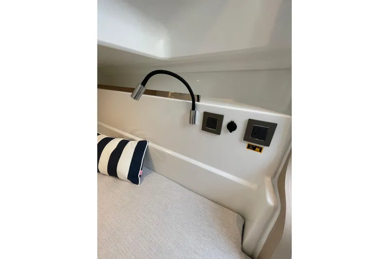 Slide: The Image of Interior of 2026 Jeanneau TH33 yacht with modern lighting and power outlets. - 28