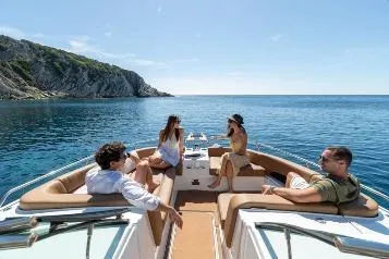 Slide: The Image of 2026 Jeanneau TH33 yacht with passengers enjoying a sunny day on the water. - 3