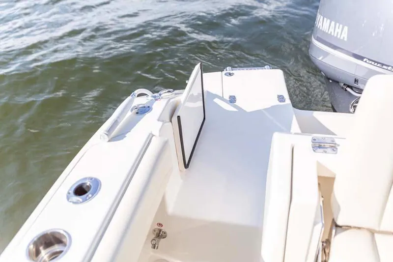 Slide: The Image of Manufacturer Provided Image: 2025 Cobia 240 Dual Console boat with Yamaha engine on water. - 14