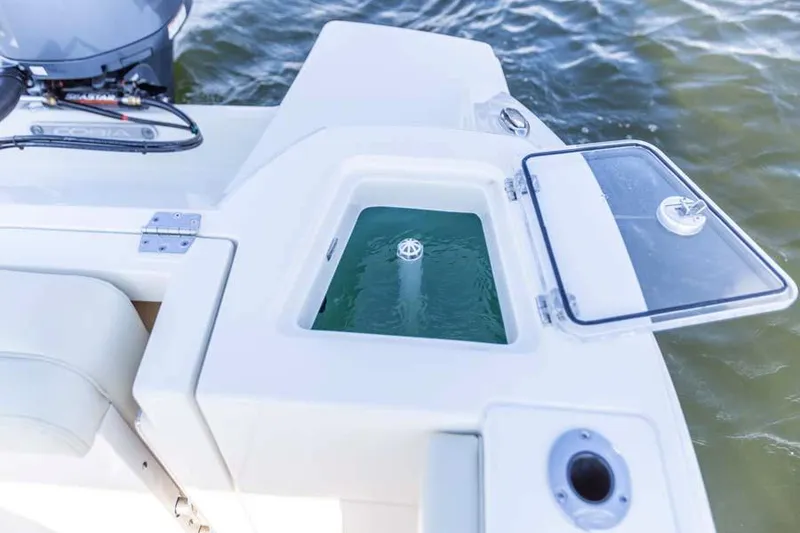 Slide: The Image of Manufacturer Provided Image: 2025 Cobia 240 Dual Console boat with open livewell on deck. - 15