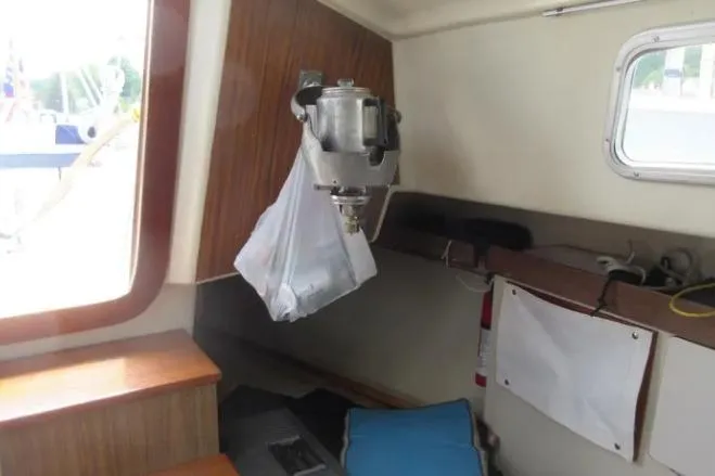 Slide: The Image of 1974 Pearson 30 sailboat interior with mounted blender and wooden cabinetry. - 22
