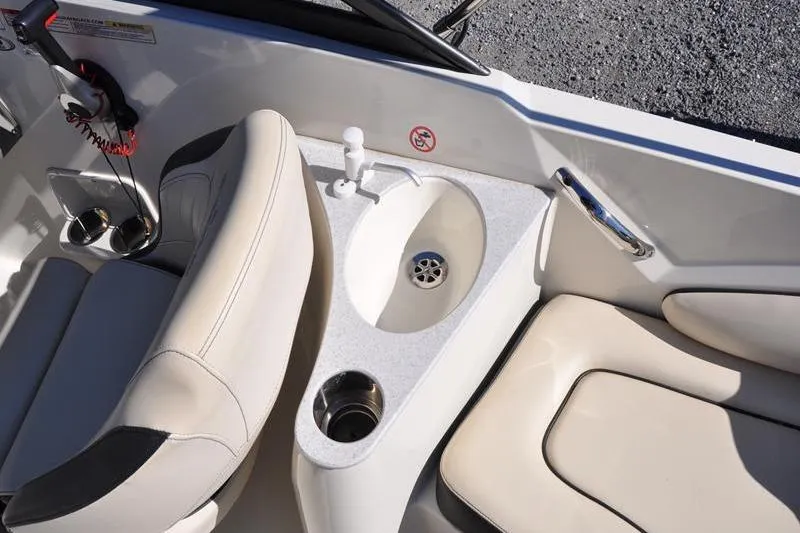 Slide: The Image of 2021 Stingray 201 DS boat interior with sink and seating area. - 24
