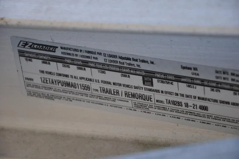 Slide: The Image of Label on EZ Loader trailer, showing VIN and compliance details for Stingray 201 DS, 2021. - 27