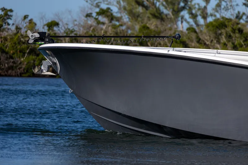 Slide: The Image of 2023 Yellowfin 42 boat cruising on calm water. - 14