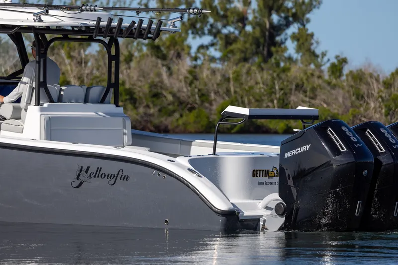 Slide: The Image of 2023 Yellowfin 42 boat with dual Mercury engines on the water. - 16