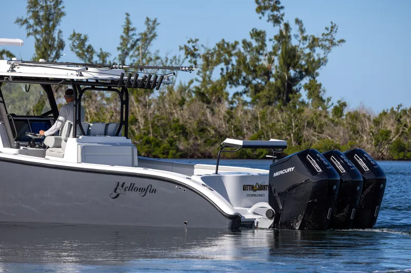 Slide: The Image of 2023 Yellowfin 42 boat with triple Mercury outboard engines on the water. - 17