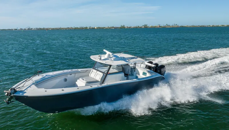 Slide: The Image of 2023 Yellowfin 42 boat cruising on open water. - 22