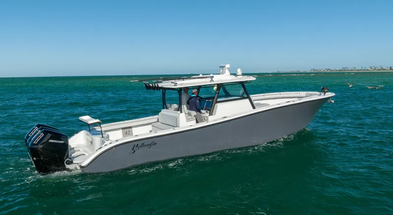 Slide: The Image of 2023 Yellowfin 42 boat cruising on open water. - 24