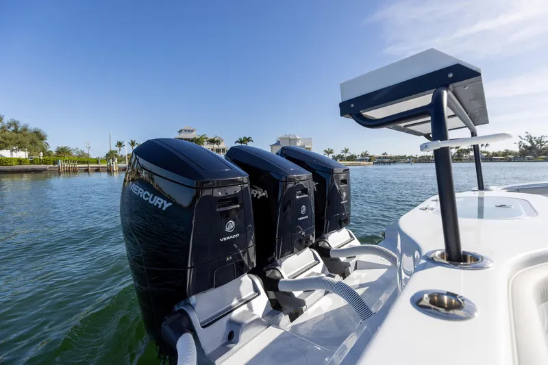Slide: The Image of 2023 Yellowfin 42 boat with triple Mercury outboard engines on the water. - 27