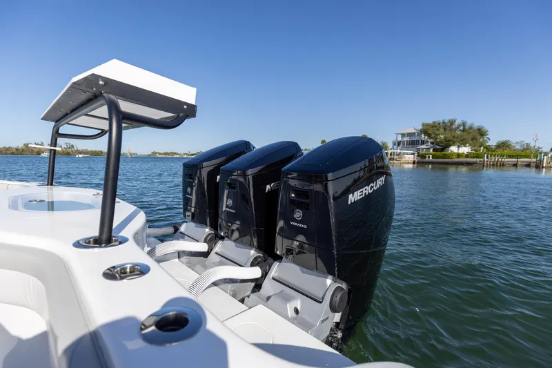 Slide: The Image of 2023 Yellowfin 42 boat with triple Mercury outboard engines on water. - 28