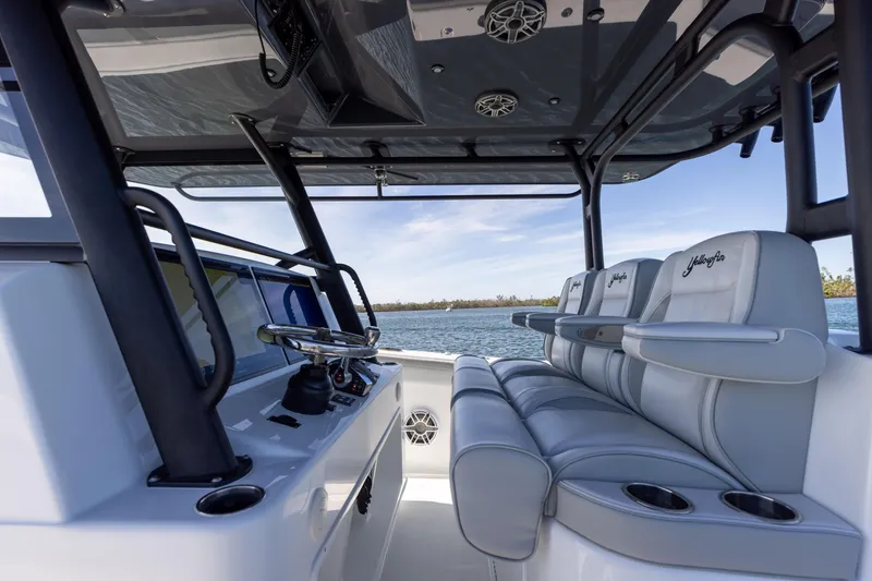 Slide: The Image of 2023 Yellowfin 42 boat interior with seating and steering console. - 41