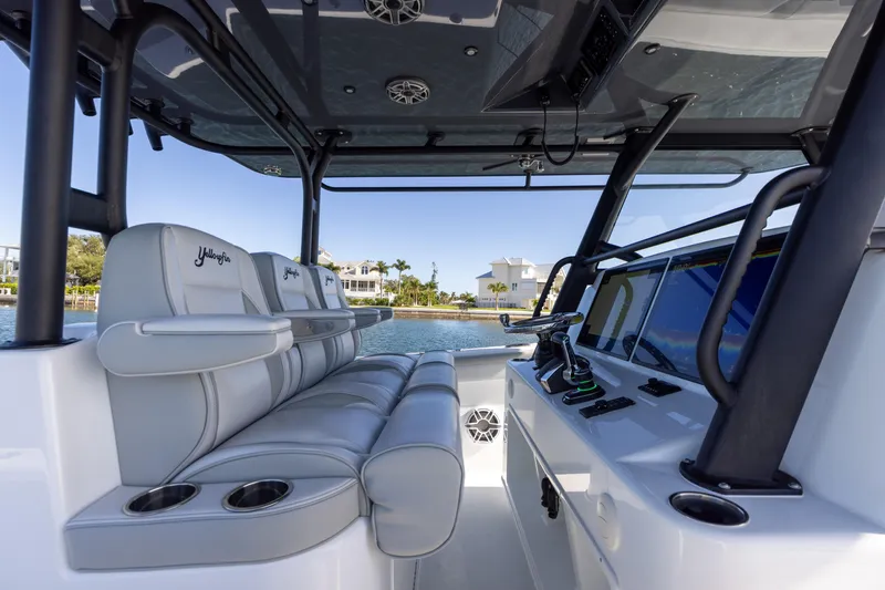 Slide: The Image of Interior of 2023 Yellowfin 42 boat with luxurious seating and modern controls. - 42