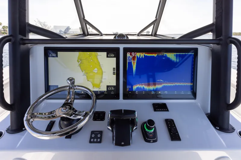 Slide: The Image of 2023 Yellowfin 42 boat dashboard with navigation and sonar screens. - 44