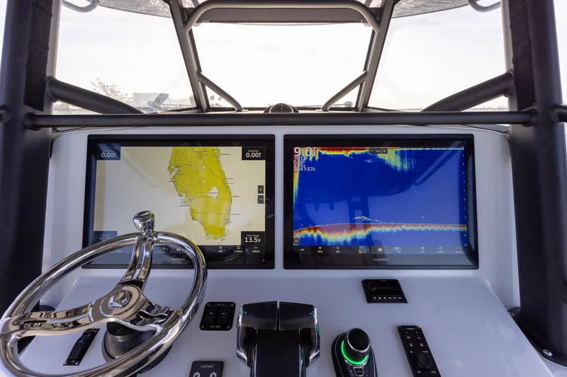 Slide: The Image of 2023 Yellowfin 42 boat dashboard with navigation and sonar screens. - 45
