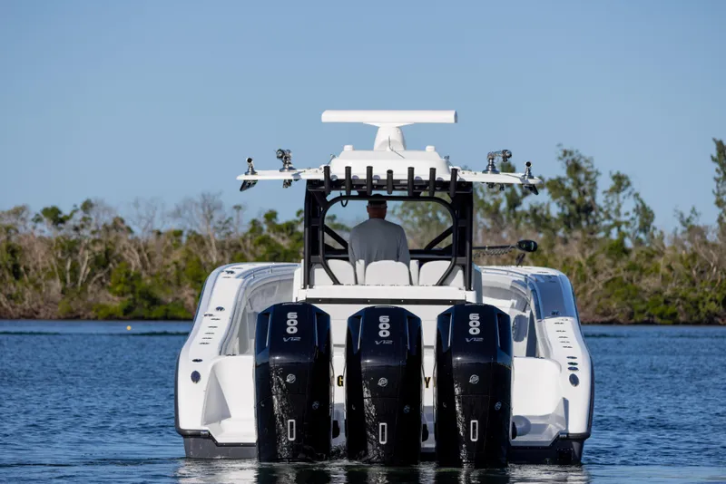 Slide: The Image of 2023 Yellowfin 42 boat with quad 600 horsepower engines on calm water. - 7