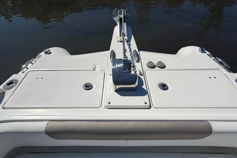 Slide: The Image of 2023 World Cat 255 DC boat deck with anchor and storage compartments. - 11