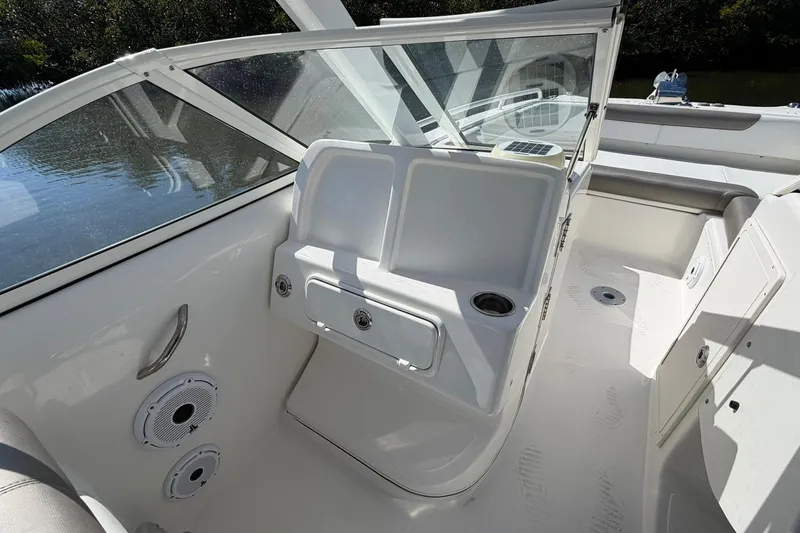 Slide: The Image of 2023 World Cat 255 DC boat interior with seating and storage compartments. - 15