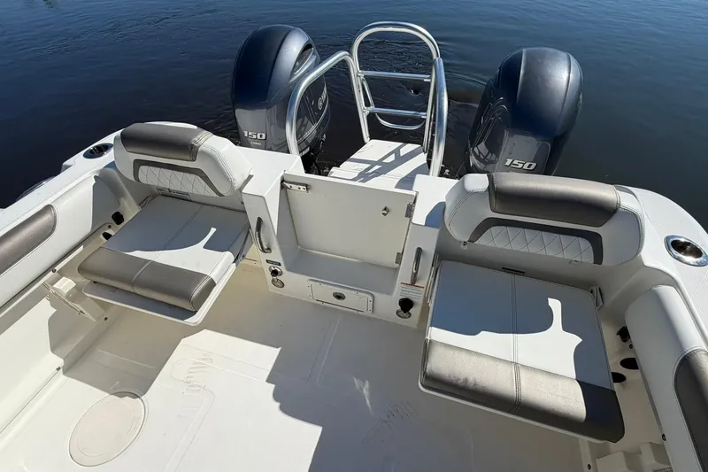 Slide: The Image of 2023 World Cat 255 DC boat interior with seating and dual 150 engines. - 20
