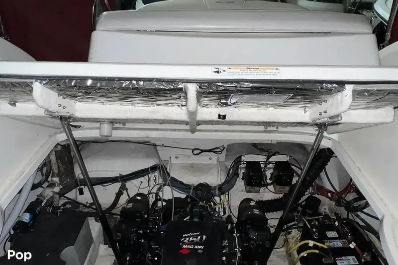 Slide: The Image of Engine compartment of a 2007 Maxum 2600 SE boat, showing mechanical components. - 15