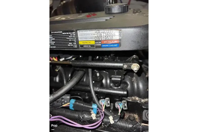 Slide: The Image of 2007 Maxum 2600 SE engine close-up with specifications label visible. - 16