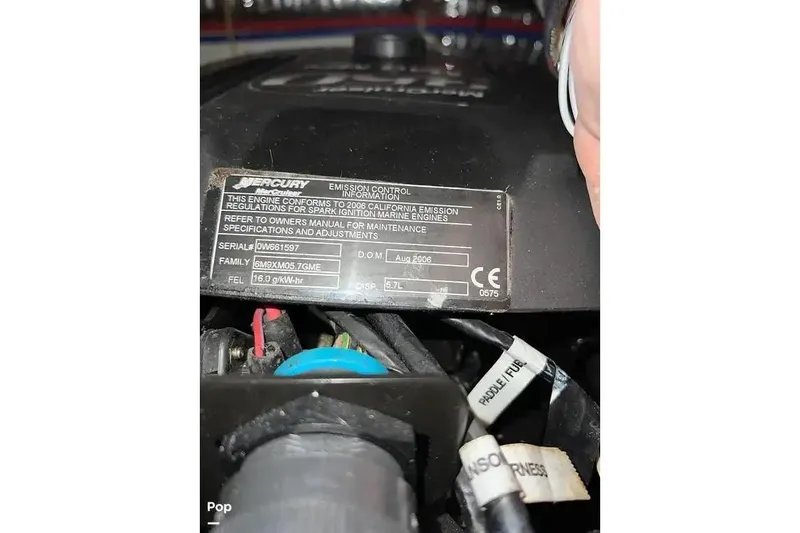 Slide: The Image of 2007 Maxum 2600 SE engine label showing Mercury emission control information. - 17
