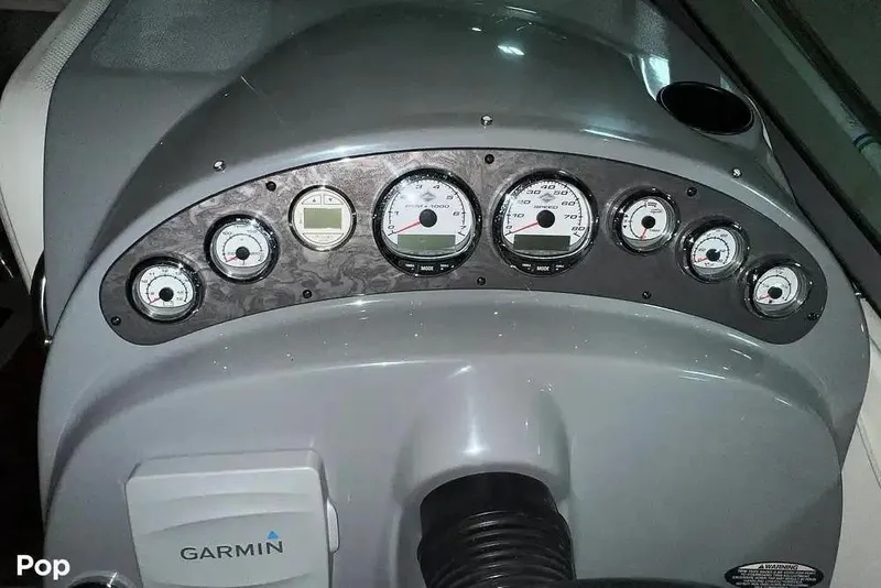 Slide: The Image of Dashboard of 2007 Maxum 2600 SE boat with gauges and Garmin device. - 3
