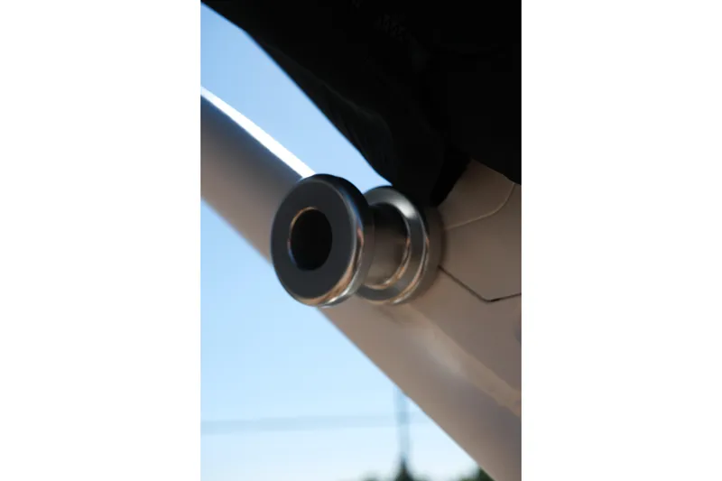 Slide: The Image of Close-up of a 2026 MasterCraft XT24 boat component against a clear blue sky. - 12