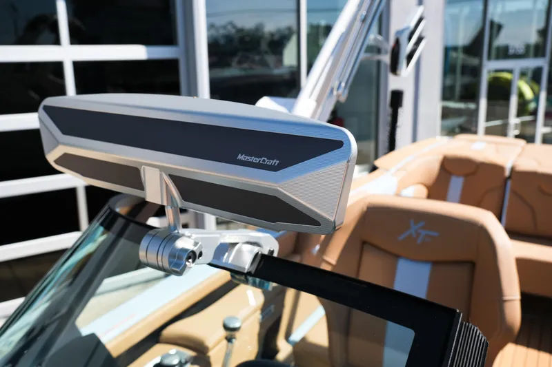 Slide: The Image of 2026 MasterCraft XT24 boat interior with advanced rearview mirror and tan seating. - 15