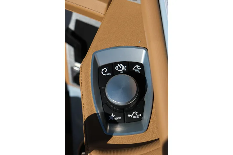 Slide: The Image of Control panel of 2026 MasterCraft XT24 boat with various function buttons. - 18