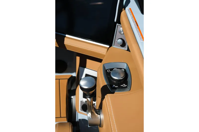 Slide: The Image of 2026 MasterCraft XT24 boat control panel with sleek design and modern features. - 19