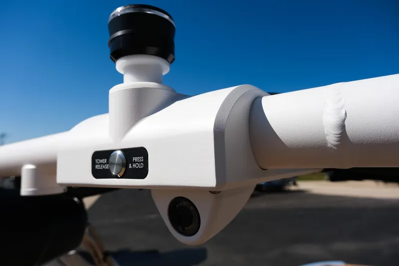 Slide: The Image of Close-up of 2026 MasterCraft XT24 tower release button under clear blue sky. - 21