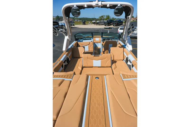 Slide: The Image of 2026 MasterCraft XT24 boat interior with tan seating and modern design. - 28