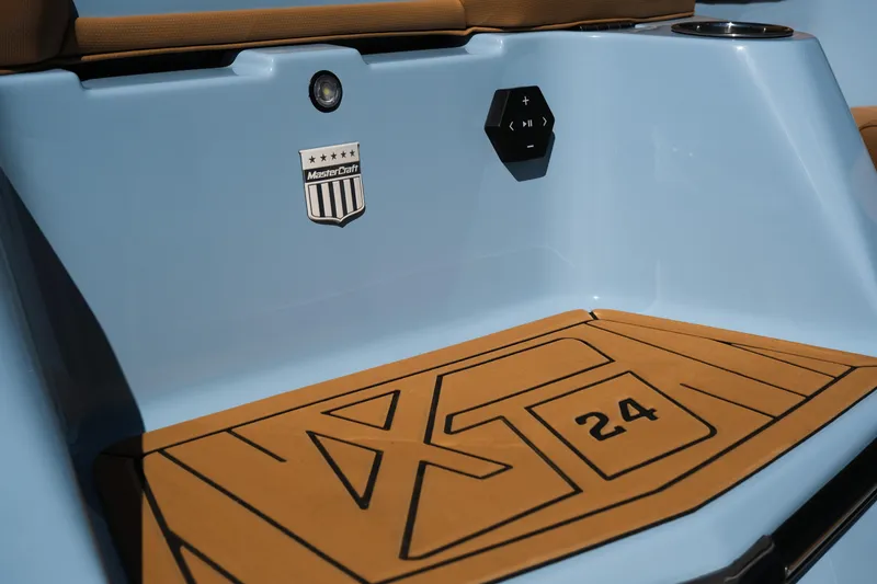 Slide: The Image of 2026 MasterCraft XT24 boat interior with logo and control panel. - 29