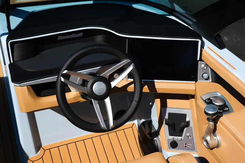Slide: The Image of 2026 MasterCraft XT24 boat cockpit with modern steering wheel and control panel. - 9