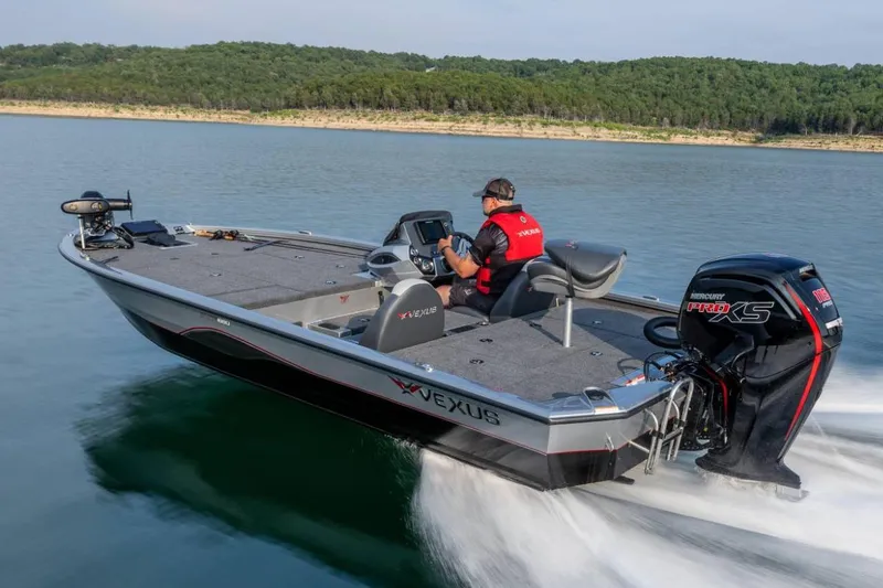 Slide: The Image of Manufacturer Provided Image: 2026 Vexus AVX 1880 boat cruising on a lake with a Mercury Pro XS engine. - 2