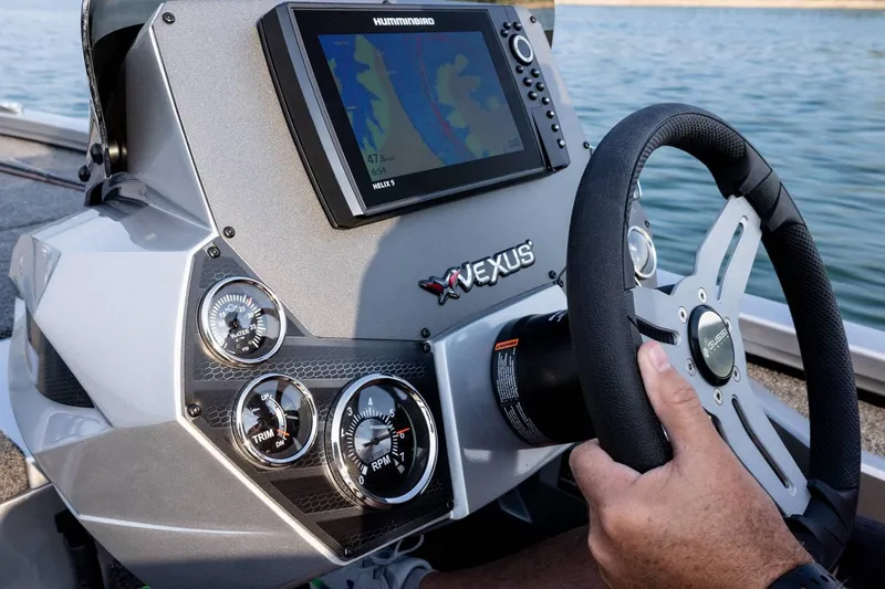 Slide: The Image of Manufacturer Provided Image: 2026 Vexus AVX 1880 boat dashboard with steering wheel and navigation display. - 5