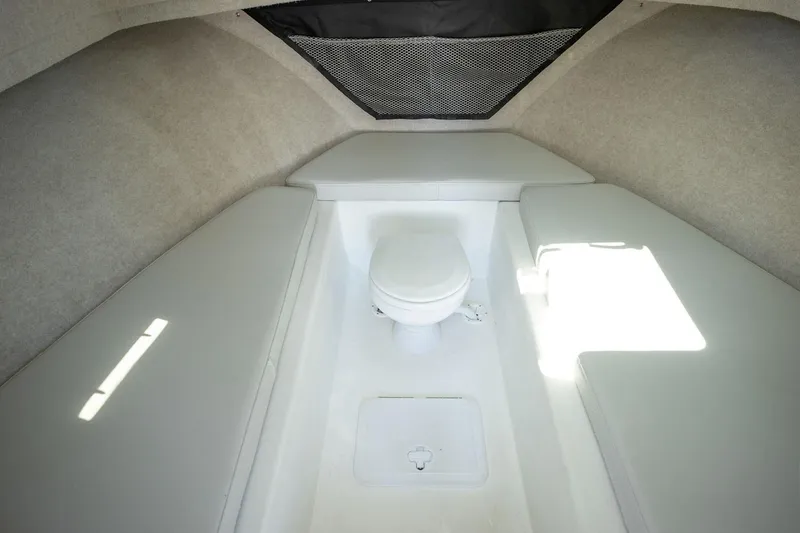 Slide: The Image of Manufacturer Provided Image: Interior cabin of 2026 Parker 287 Explorer boat with seating and toilet. - 11