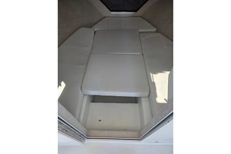 Slide: The Image of Interior cabin of 2026 Parker 287 Explorer boat with white cushioned seating. - 16