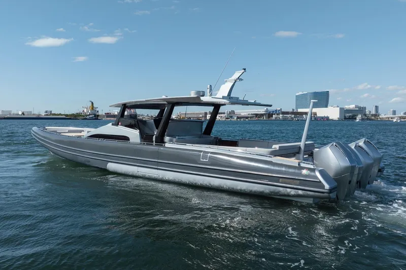 Slide: The Image of 2022 Novamarine BS 160 Outboard boat cruising on a sunny day near a city skyline. - 15