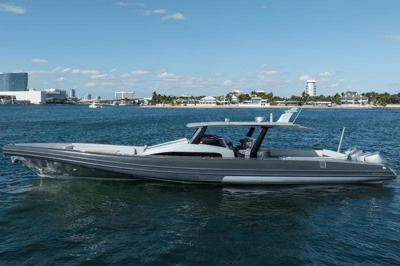 Slide: The Image of 2022 Novamarine BS 160 Outboard boat on calm water, cityscape in background. - 17