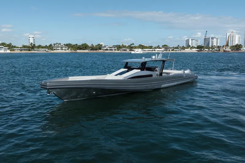 Slide: The Image of 2022 Novamarine BS 160 Outboard boat cruising on a sunny day near a coastal cityscape. - 18