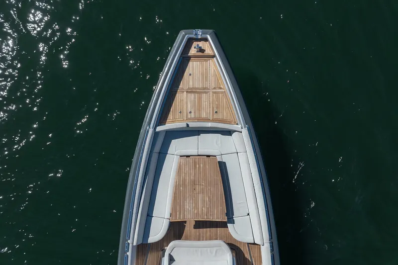 Slide: The Image of Top view of 2022 Novamarine BS 160 Outboard boat with wooden deck on water. - 24