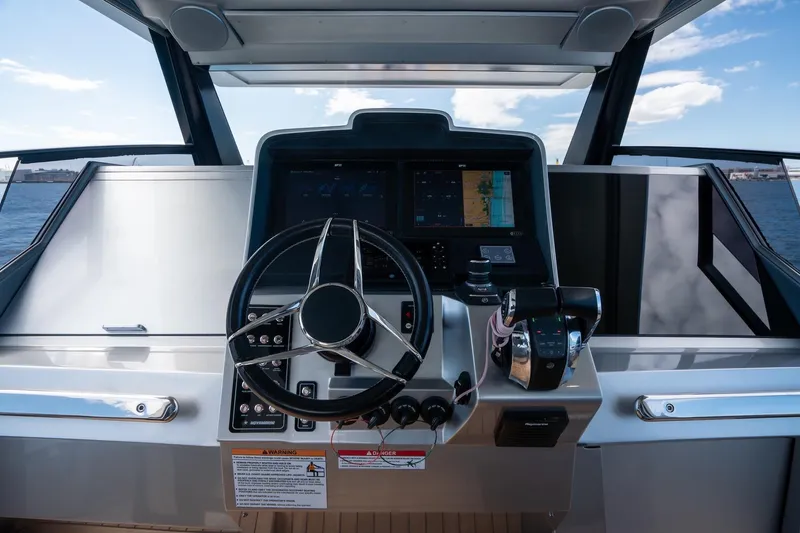 Slide: The Image of Cockpit of 2022 Novamarine BS 160 Outboard with steering wheel and navigation system. - 28
