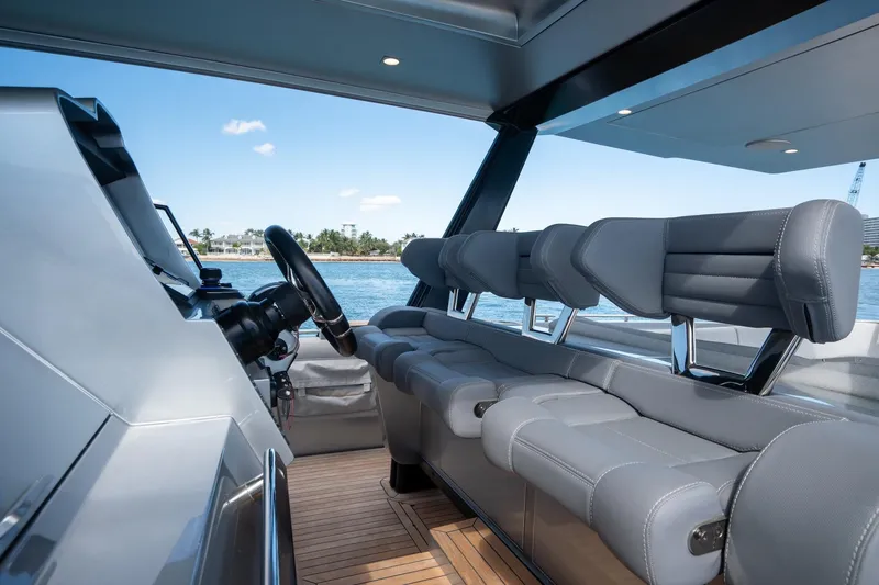 Slide: The Image of Interior of 2022 Novamarine BS 160 Outboard boat with sleek seating and steering wheel. - 29