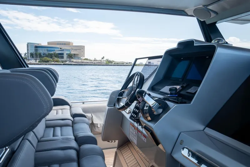 Slide: The Image of Interior view of 2022 Novamarine BS 160 Outboard boat with modern dashboard and seating. - 3