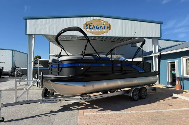 The Image of 2024 Bennington SSB-SPS pontoon boat on trailer at Seagate Marine Sales. - 1