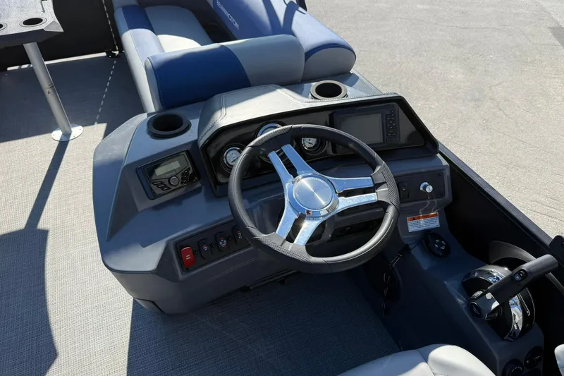 Slide: The Image of 2024 Bennington SSB-SPS boat dashboard with steering wheel and controls. - 10
