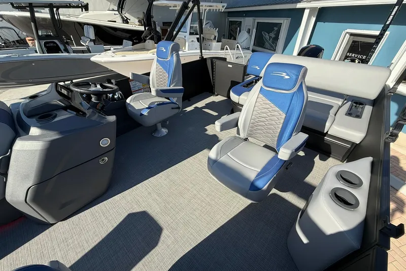Slide: The Image of 2024 Bennington SSB-SPS boat interior with modern seating and steering console. - 11